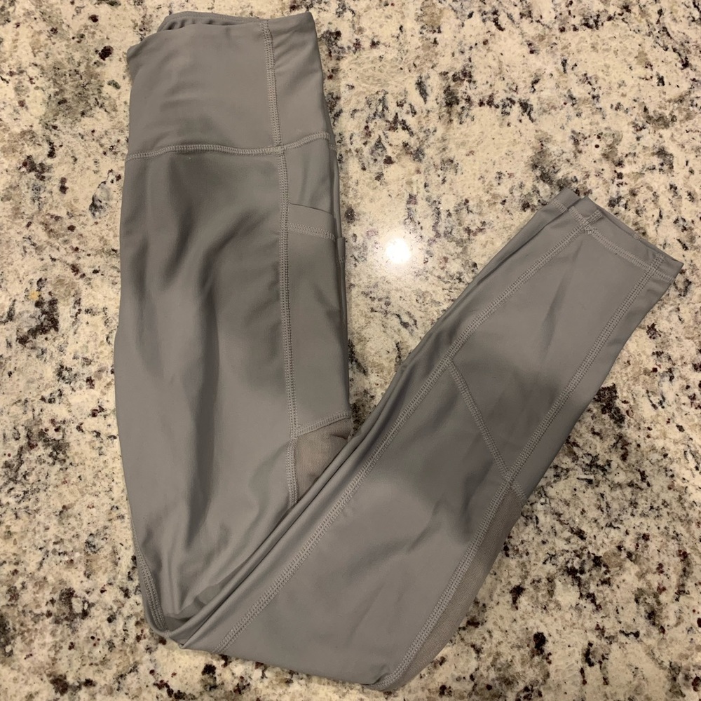 Gray straight leg leggings, peephole sides with pockets
